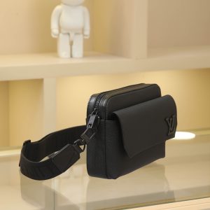 Alternative view of Black Full-Grain Leather This Fastline messenger bag is crafted from supple cowhide leather, blending contemporary style with practical functionality. Its form-fitting design accommodates a smartphone, compact wallet, notebook, and headphones, while the front pocket provides easy access to essentials. The signature shoulder strap is removable and adjustable, offering versatile carrying options over the shoulder or crossbody. Size: 23.5 x 18 x 7 cm (Length x Height x Width)